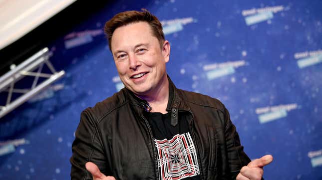 A photo of Elon Musk giving a thumbs up.