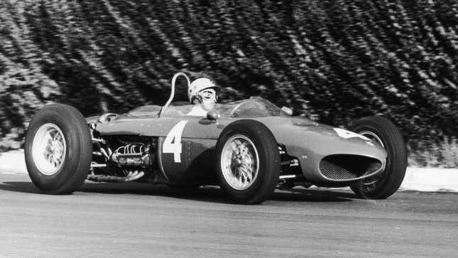 A black and white photo of Ricardo Rodríguez driving an F1 car. 