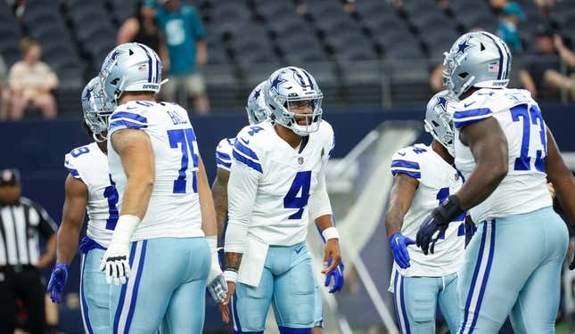 Aug 12, 2023; Arlington, Texas, USA; Dallas Cowboys quarterback Dak Prescott (4) greets teammates before the game against the Jacksonville Jaguars at AT&T Stadium.