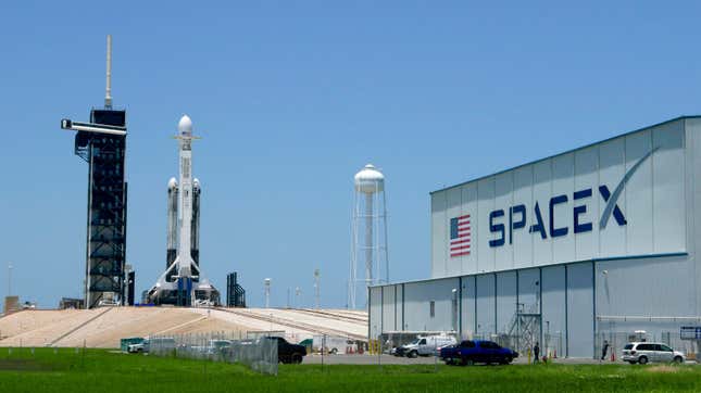 A SpaceX Falcon Heavy rocket stands ready for launch at the Kennedy Space Center in Cape Canaveral, Florida, Monday, June 24, 2019.