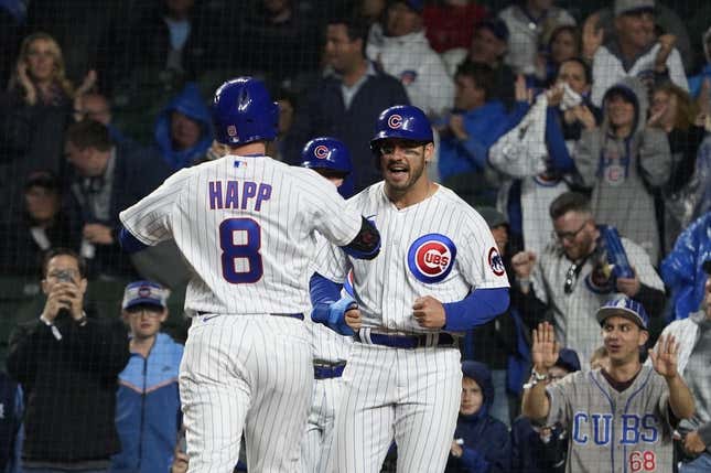 Jun 13, 2023; Chicago, Illinois, USA; Chicago Cubs left fielder Ian Happ (8) is greeted by center fielder Mike Tauchman (40) after hitting a three run homer against the Pittsburgh Pirates during the first inning at Wrigley Field.