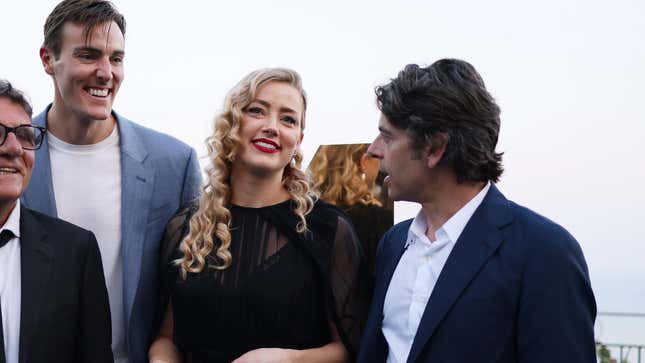 In the Fire director Conor Allyn (left), Amber Heard and Luca Calvani (right) at the Taormina Film Festival in Italy.