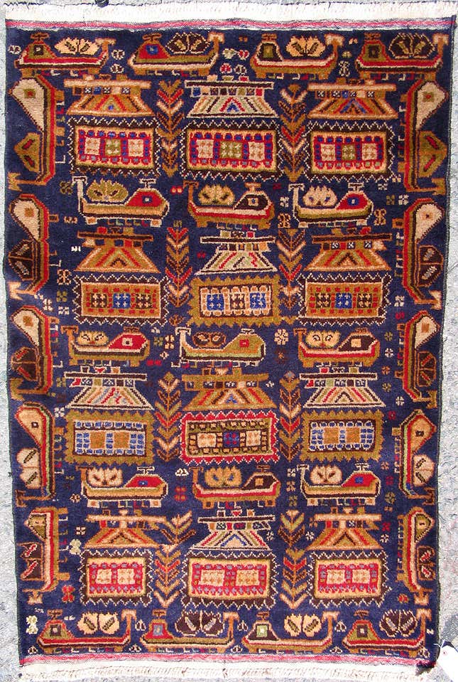 Image for article titled Afghan carpet weavers are putting drones on their rugs