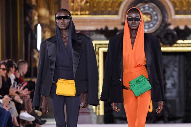 A model, sunglasses detail, walks the runway at the Fendi fashion