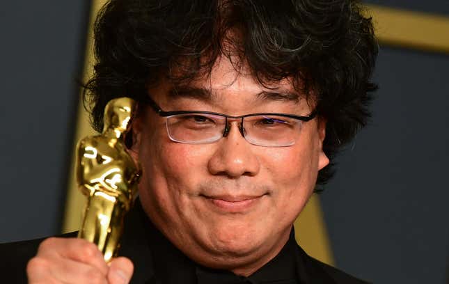 Bong Joon-ho celebrating his wins: Best Original Screenplay, Best Director, International Feature Film, and Best Picture