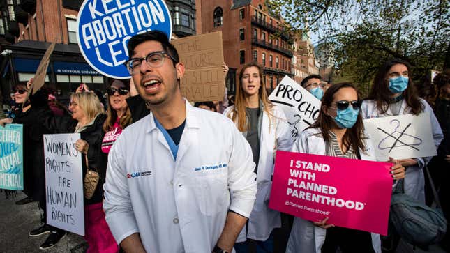 A group of doctors and medical workers join protesters gathering in front of the State House to show support and rally for abortion rights in Boston, Massachusetts, May 3, 2022.