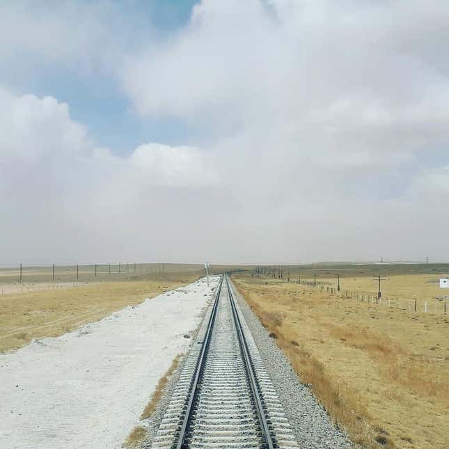 A train track stretching for miles across the Mongolian plains