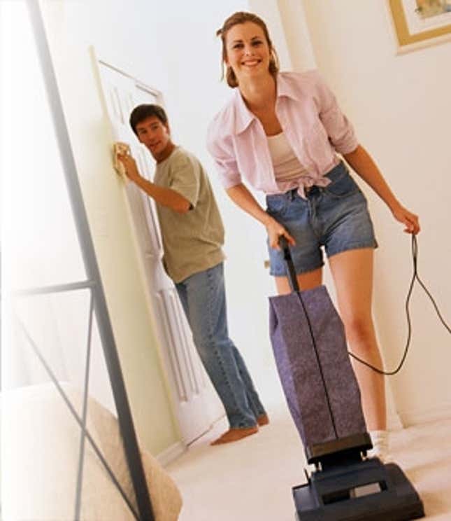 Couple cleaning the house