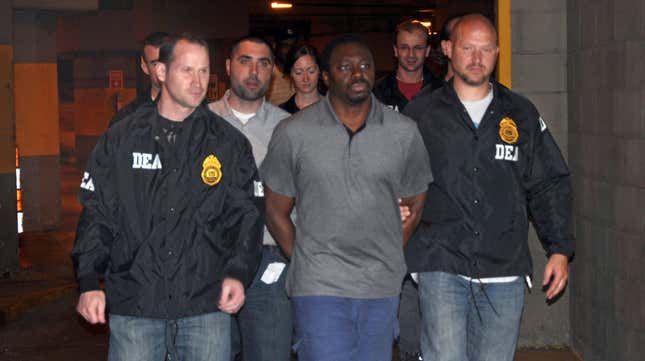 In this photo provided by the United States Drug Enforcement Administration, DEA agents escort James Rosemond after his arrest on cocaine-dealing charges, Tuesday, June 21, 2011 in New York. The arrest follows accusations last week that Rosemond, owner of Czar Entertainment, was involved in a mid-1990s ambush of Shakur outside a Manhattan recording studio. 