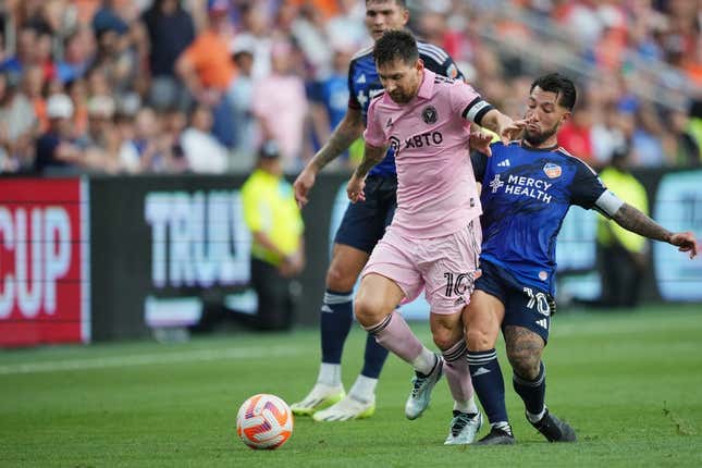Aug 23, 2023; Cincinnati, OH, USA; Inter Miami forward Lionel Messi (10) plays the ball defended by FC Cincinnati midfielder Luciano Acosta (10) in the first half at TQL Stadium.