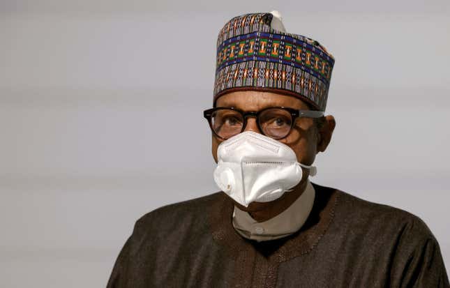Nigeria's President Muhammadu Buhari poses before the opening session of the Summit on the Financing of African Economies in Paris, France May 18.
