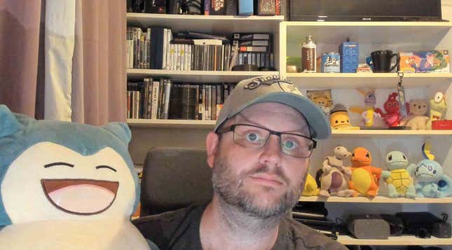 Me, my Snorlax, and shelves full of nonsense.