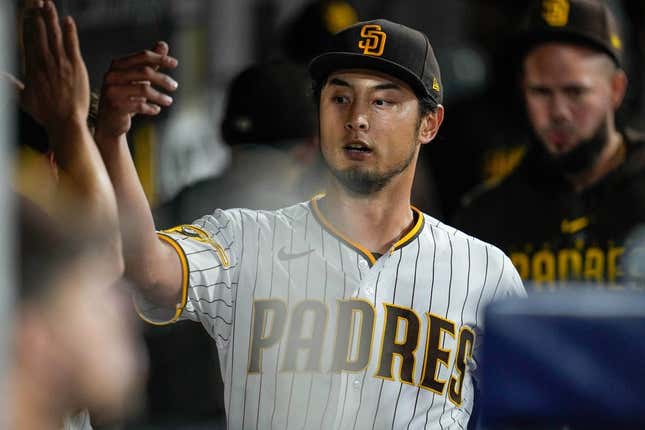 Jun 3, 2023; San Diego, California, USA;  San Diego Padres starting pitcher Yu Darvish (11) is greeted by teammates after the seventh inning against the Chicago Cubs at Petco Park.