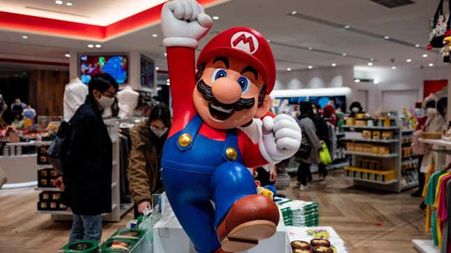 A Mario statue at a Nintendo store jumps for joy. 