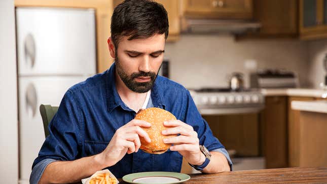Image for article titled Man Inspects Perimeter To Find Most Vulnerable Entry Point To Hamburger