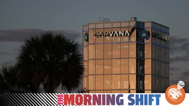 A photo of the Carvana glass tower of cars with The Morning Shift banner. 