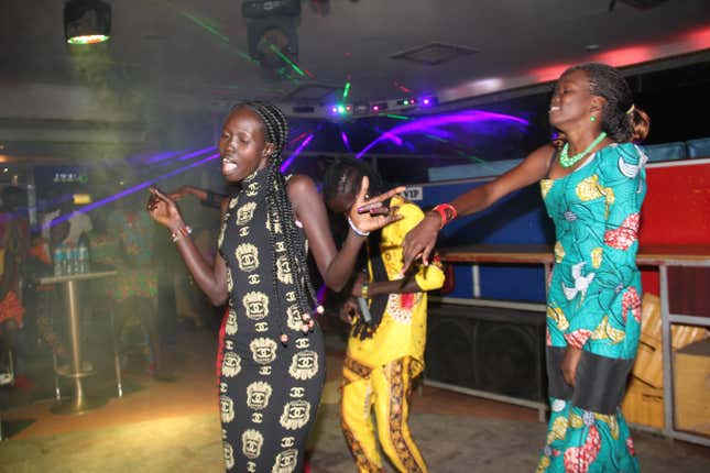 Women perform at a day party at Club Signature in Juba South Sudan in October.