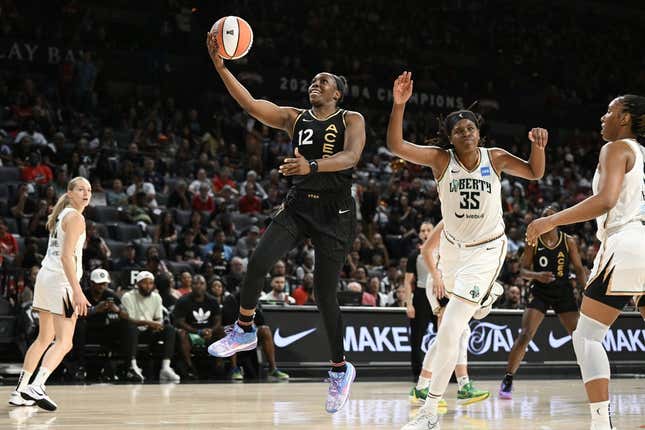 Aug 15, 2023; Las Vegas, Nevada, USA; Las Vegas Aces guard Chelsea Gray (12) drives to the basket against the New York Liberty in the second quarter at Michelob Ultra Arena.