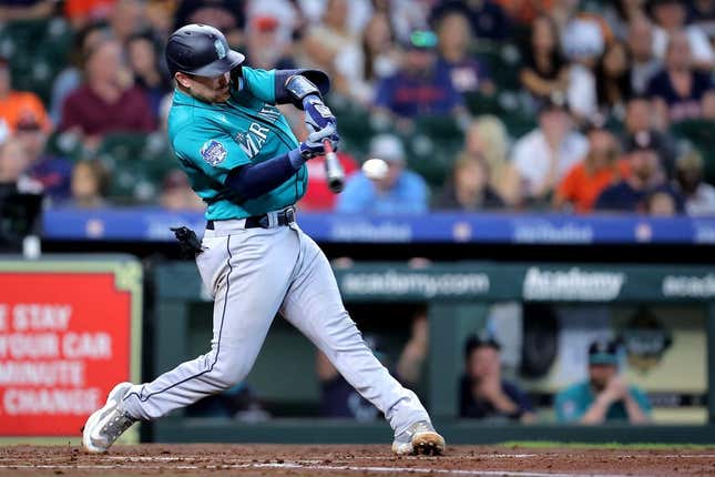 Aug 20, 2023; Houston, Texas, USA; Seattle Mariners catcher Brian O&#39;Keefe (64) hits an RBI double to left field against the Houston Astros during the third inning at Minute Maid Park.