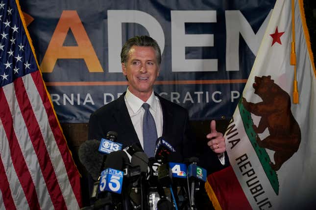 California Gov. Gavin Newsom addresses reporters, after beating back the recall attempt that aimed to remove him from office, at the John L. Burton California Democratic Party headquarters in Sacramento, Calif., Tuesday, Sept. 14, 2021. 