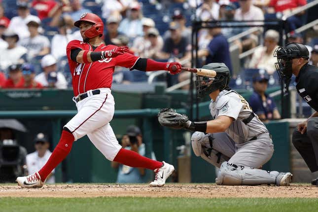 Aug 13, 2023; Washington, District of Columbia, USA; Washington Nationals shortstop Ildemaro Vargas (14) hits a single against the Oakland Athletics during the third inning at Nationals Park.