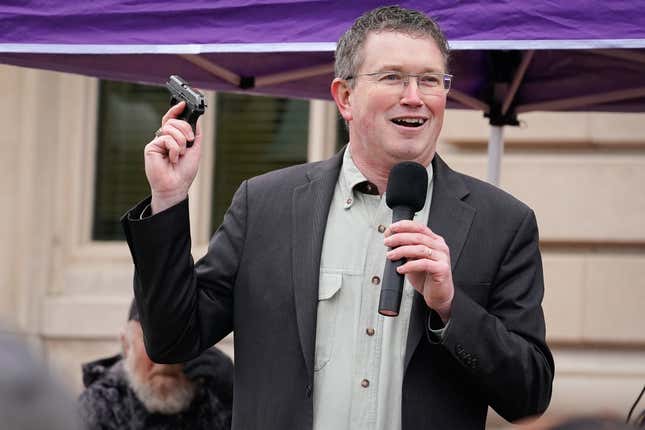 Rep Thomas Massie (R-KY) draws a Ruger LCP handgun from his pocket during a rally in support of the Second Amendment on January 31, 2020 in Frankfort, Kentucky.