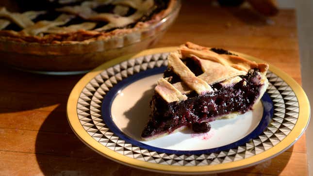 A photo of a slice of blueberry pie. 