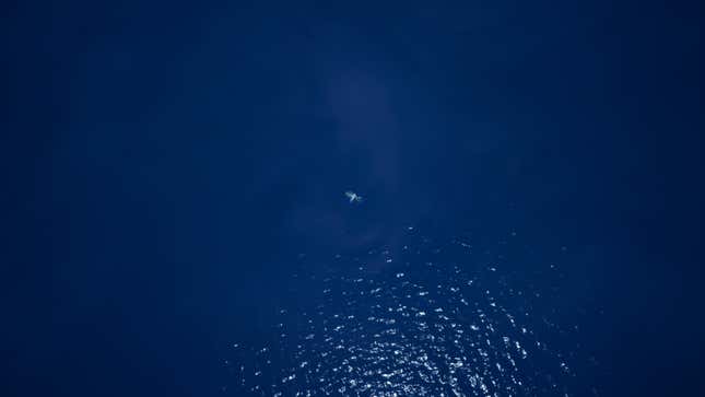A character floating in the middle of the ocean at the end of Fortnite Chapter Two.