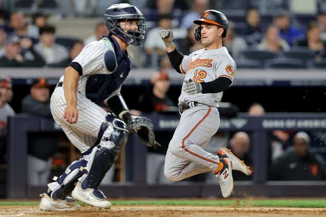 Baltimore Orioles second baseman Adam Frazier (12) gets in