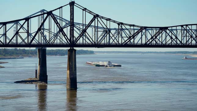 Low-water restrictions on the barge loads make for cautious navigation through the Mississippi River as evidenced by this tow passing under the Mississippi River bridges in Vicksburg, Tuesday, Oct. 11, 2022.