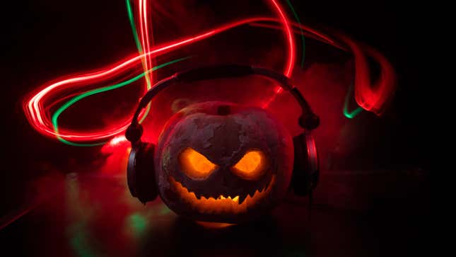 A photo illustration of a scary jack o'lantern wearing headphones