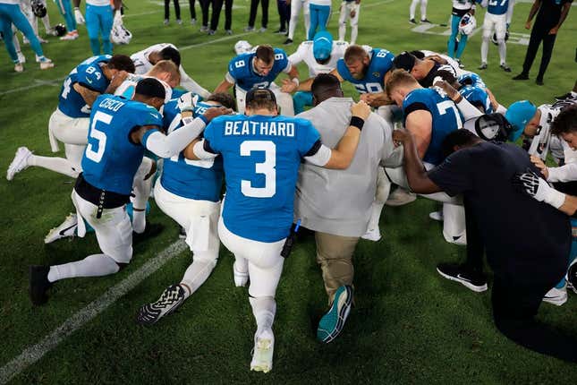 Jacksonville Jaguars quarterback C.J. Beathard (3) prays with players after the game of a preseason matchup Saturday, Aug. 26, 2023 at EverBank Stadium in Jacksonville, Fla. The game was suspended in the fourth after Miami Dolphins wide receiver Daewood Davis (87) was injured on a play with a final score of 31-18.