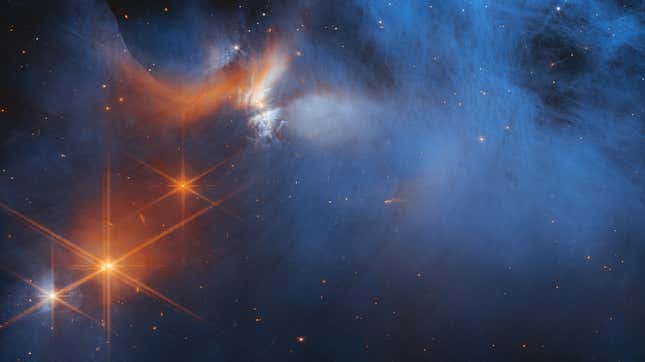 A Webb NIRCam image of Chamaeleon I, with background stars shining through.