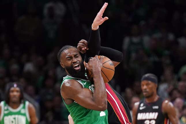May 29, 2023; Boston, Massachusetts, USA; Boston Celtics guard Jaylen Brown (7) battles for control against Miami Heat guard Max Strus (31) in the first quarter during game seven of the Eastern Conference Finals for the 2023 NBA playoffs at TD Garden.