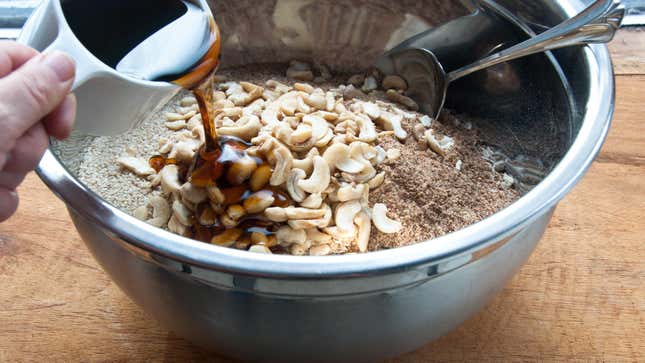Nuts and other ingredients in a mixing bowl.