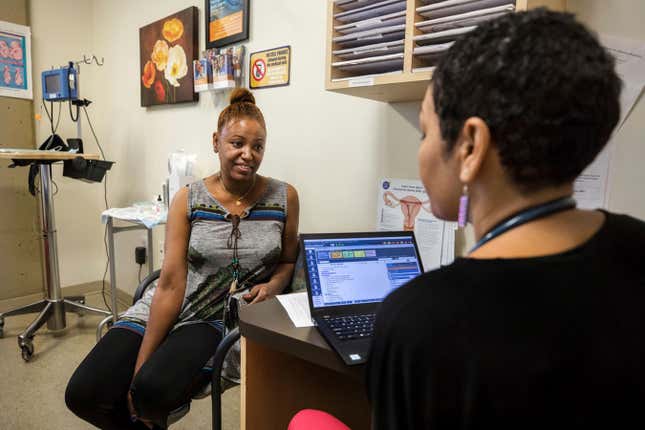 A client receives information at Mary’s Center, a community health center in Washington in 2018. The center is one of more than 2,500 publicly funded health clinics that has distributed Medicines360 products in the United States. (Medicines360 via AP)