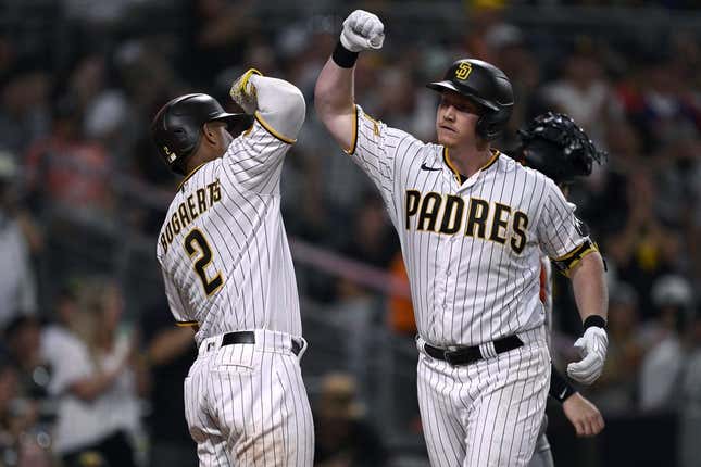 Sep 2, 2023; San Diego, California, USA; San Diego Padres first baseman Garrett Cooper (right) is congratulated by shortstop Xander Bogaerts (2) after hitting a three-run home run against the San Francisco Giants during the sixth inning at Petco Park.