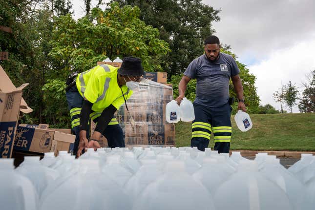 The Baltimore City Department of Public Works workers distributed jugs of water to city residents at the Landsdowne Branch of the Baltimore County Library on September 6, 2022, in Baltimore, Maryland. The City of Baltimore has issued a boil water advisory to over 1500 residential and commercial facilities in West Baltimore after E. coli bacteria were found in drinking water.