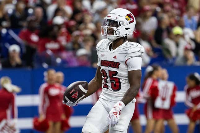 Sep 16, 2023; Indianapolis, Indiana, USA; Louisville Cardinals running back Jawhar Jordan (25) celebrates after scoring a touchdown against the Indiana Hoosiers in the second quarter at Lucas Oil Stadium.