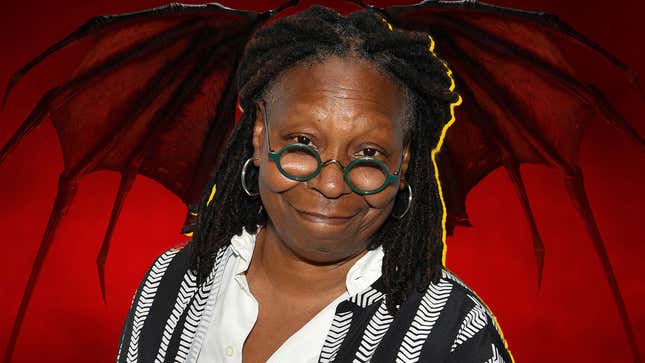 Whoopi Goldberg smiles while standing in front of a large demon from Diablo.