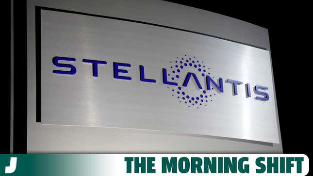 A photo of a blue Stellantis logo on a silver sign. 