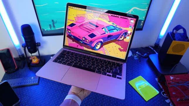 M1 Macbook Air displaying wallpaper with a pink Corvette