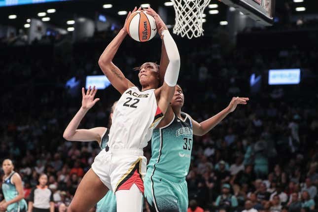 Aug 6, 2023; Brooklyn, New York, USA; Las Vegas Aces forward A&#39;ja Wilson (22) grabs a rebound in front of New York Liberty forward Jonquel Jones (35) in the third quarter at Barclays Center.