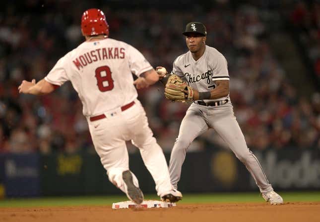 Jun 26, 2023; Anaheim, California, USA;  Los Angeles Angels first baseman Mike Moustakas (8) is out at second as Chicago White Sox shortstop Tim Anderson (7) throws to first for a double play in the seventh inning at Angel Stadium.