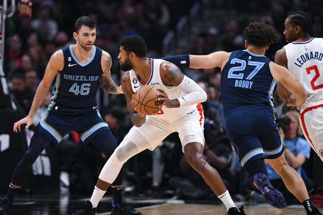 Mar 5, 2023; Los Angeles, California, USA; LA Clippers forward Paul George (13) looks to pass the ball against Memphis Grizzlies guard John Konchar (46) and forward David Roddy (27) during second quarter at Crypto.com Arena.