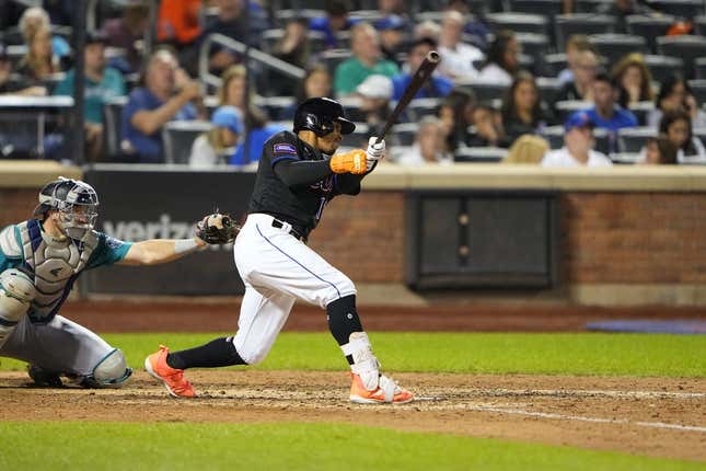 Sep 1, 2023; New York City, New York, USA;  New York Mets shortstop Francisco Lindor (12) hits a single against the Seattle Mariners during the eighth inning at Citi Field.