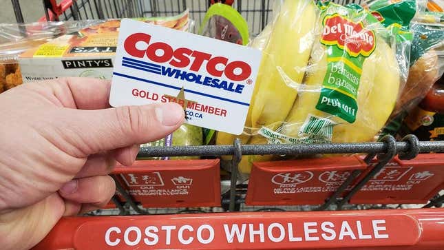 Costco membership card in front of grocery cart
