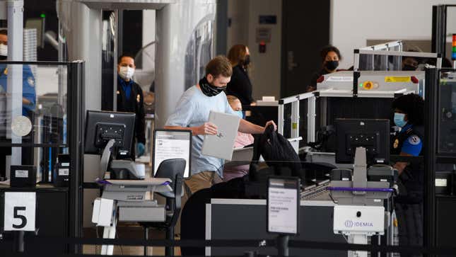 Travelers enter a new Transportation Security Administration (TSA) screening area during the opening of the Terminal 1 expansion at Los Angeles International Airport (LAX) on June 4, 2021 in Los Angeles, California.