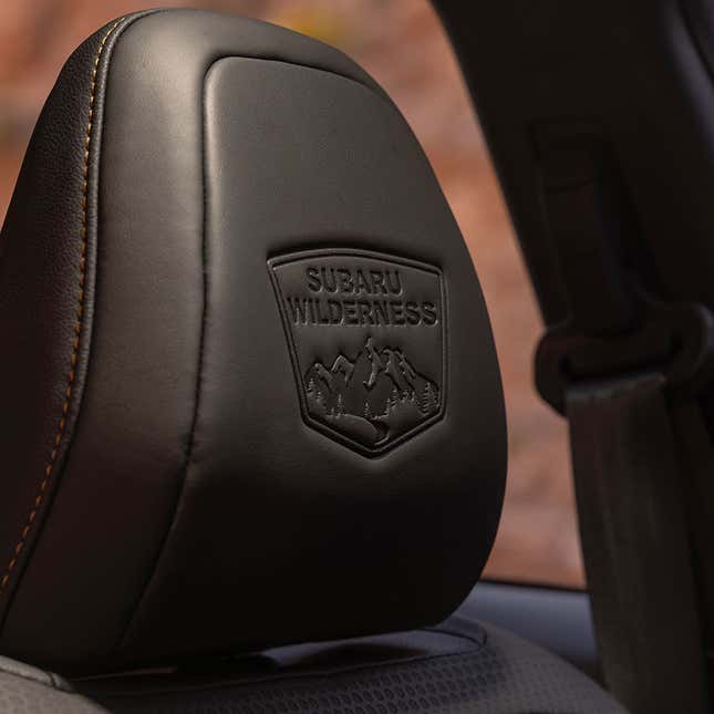 A photo of the Subaru Wilderness logo on the headrest of a seat. 