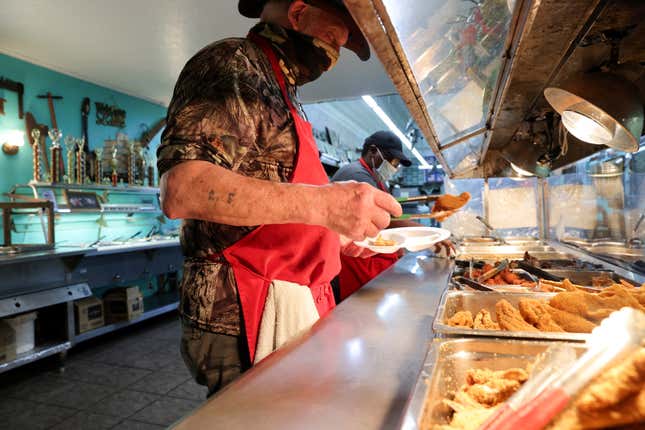 A workers prepares a buffet